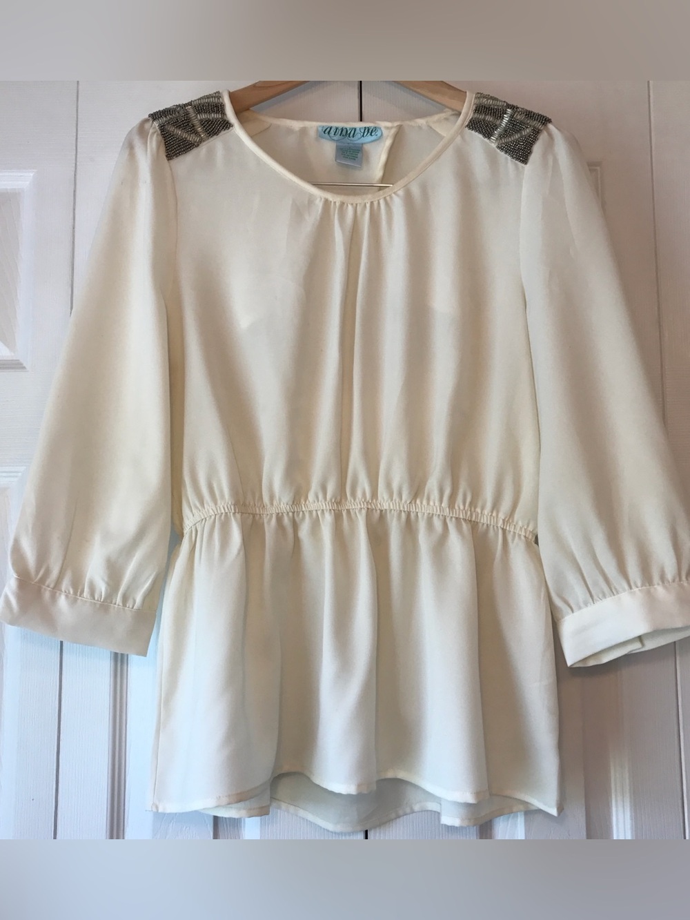 Francesca’s Ava & Viv Cream Peplum Blouse with Beaded Shoulder Accents
